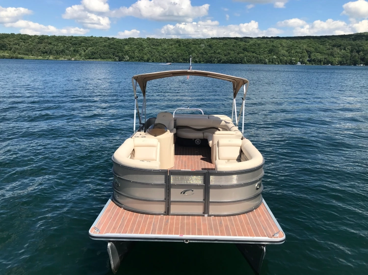 Front view of 23' Crest Pontoon boat with 60 HP Mercury Motor