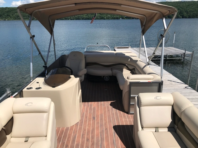 Console view of 23' Crest Pontoon boat with 60 HP Mercury Motor