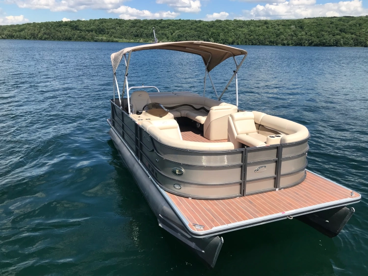 Front view of 23' Crest Pontoon boat with 60 HP Mercury Motor